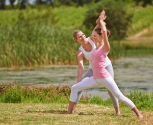 Shot of a young woman being instructed in an outdoor yoga classhttp://195.154.178.81/DATA/i_collage/pi/shoots/783393.jpg